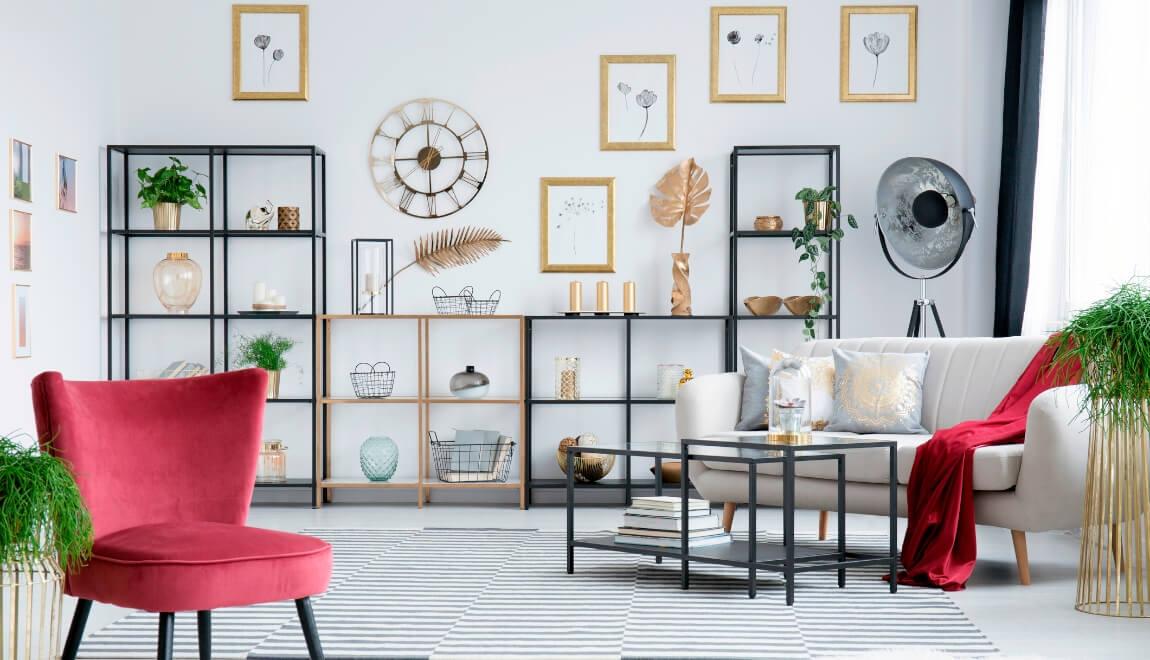 Bookcase containing a variety of art and plants.