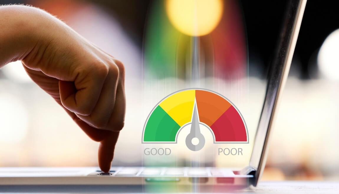 Concept of finding a credit score with someone pushing a button on a laptop and a credit score graphic over the keyboard.