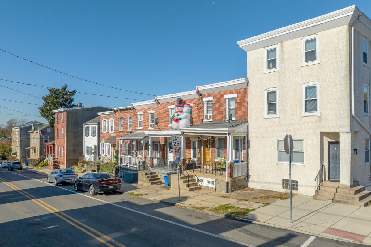Brick row homes sit on quiet streets in Roxborough, giving residents a suburban feel in the city.