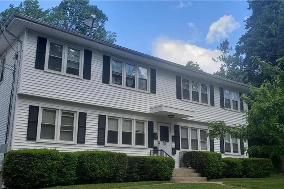 Eight large windows look out onto the front yard at 232 Glen Haven Rd.
