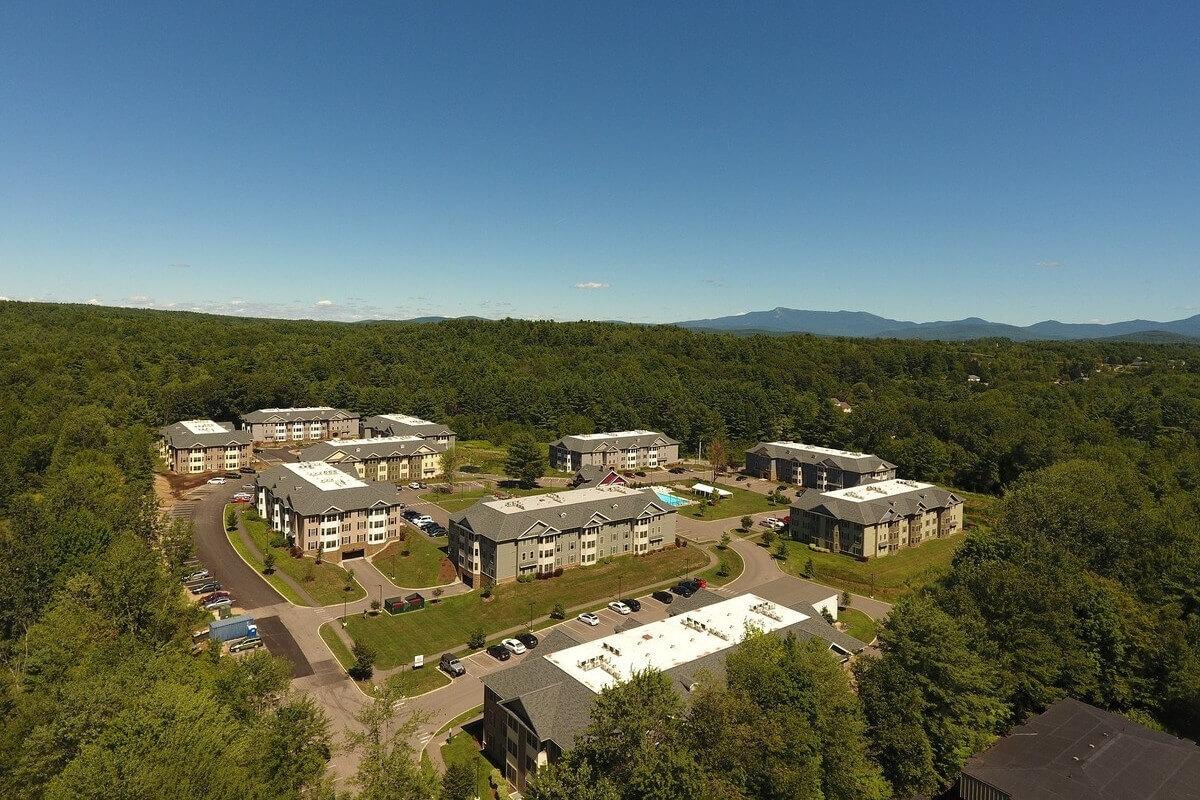 The Village at Autumn Pond apartment community sits in the middle of lush forestry.