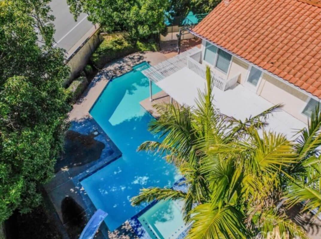 Aerial view of home with swimming pool
