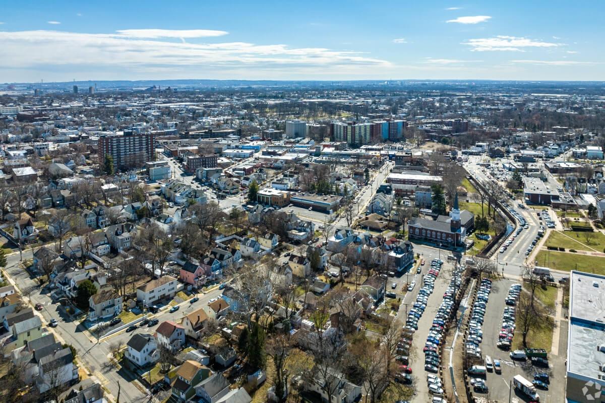 An aerial view of Irvington shows a mix of single-family homes and large high-rise apartment buildings.