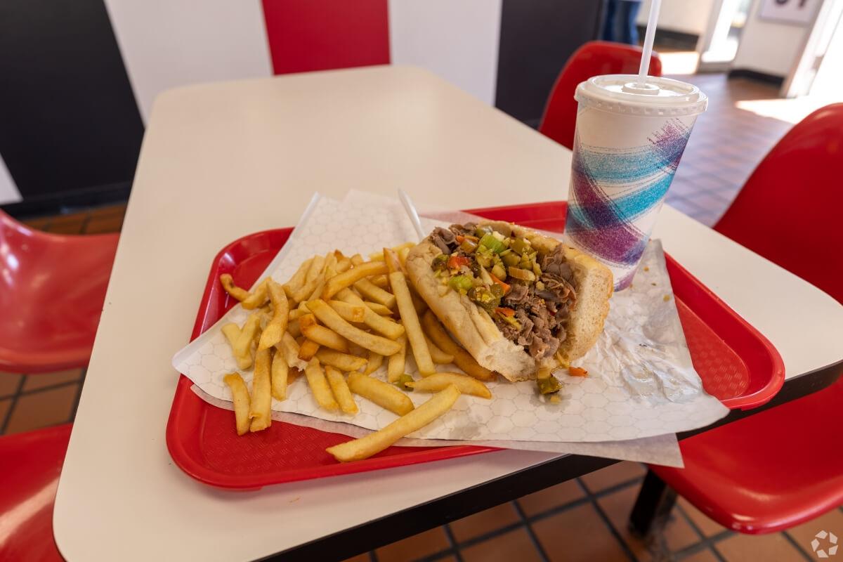Italian beef, fries, and a drink sit on a tray at Lula's Hot Dogs in Chicago.