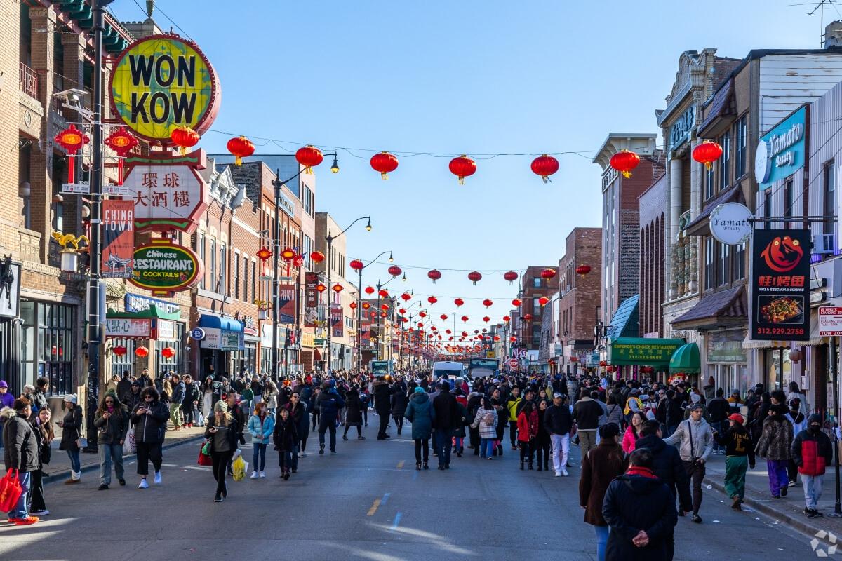 People walk down the streets of Chinatown during the Lunar New Year celebration.