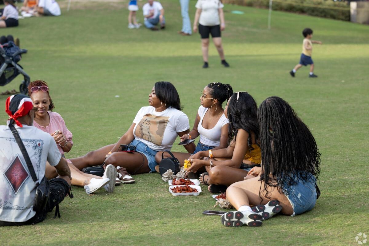Residents enjoy each other's company in a Houston park.