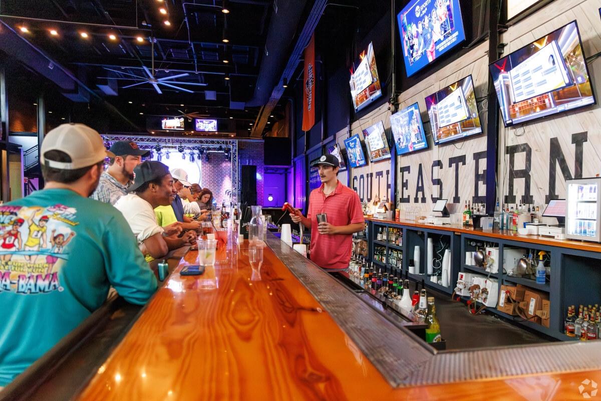 Auburn students drink at a bar.