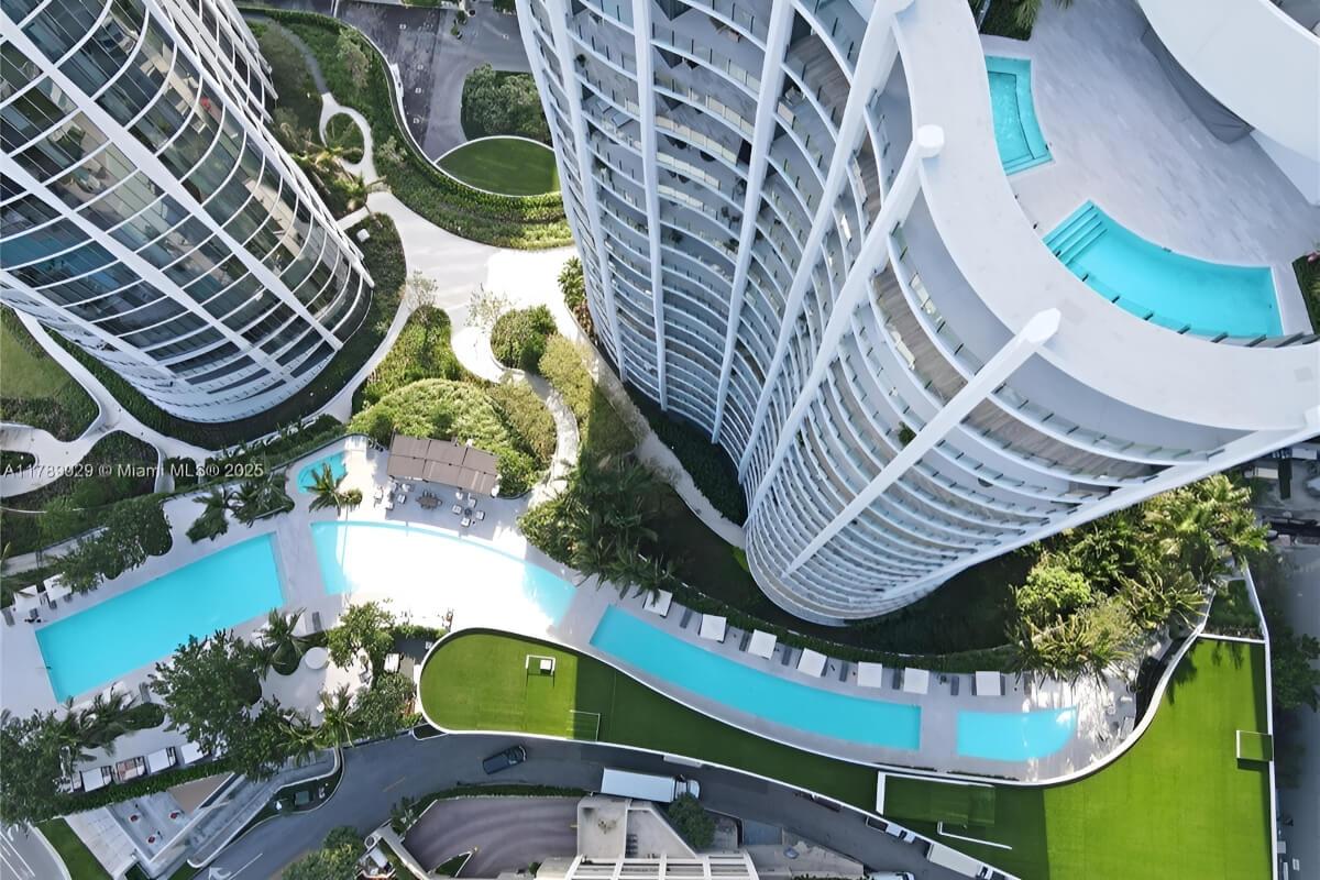 Rooftop pools sit on top of a building while several others are on the base of the main building.