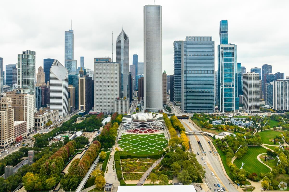 An aerial view of Millennium Park and Chicago skyscrapers.