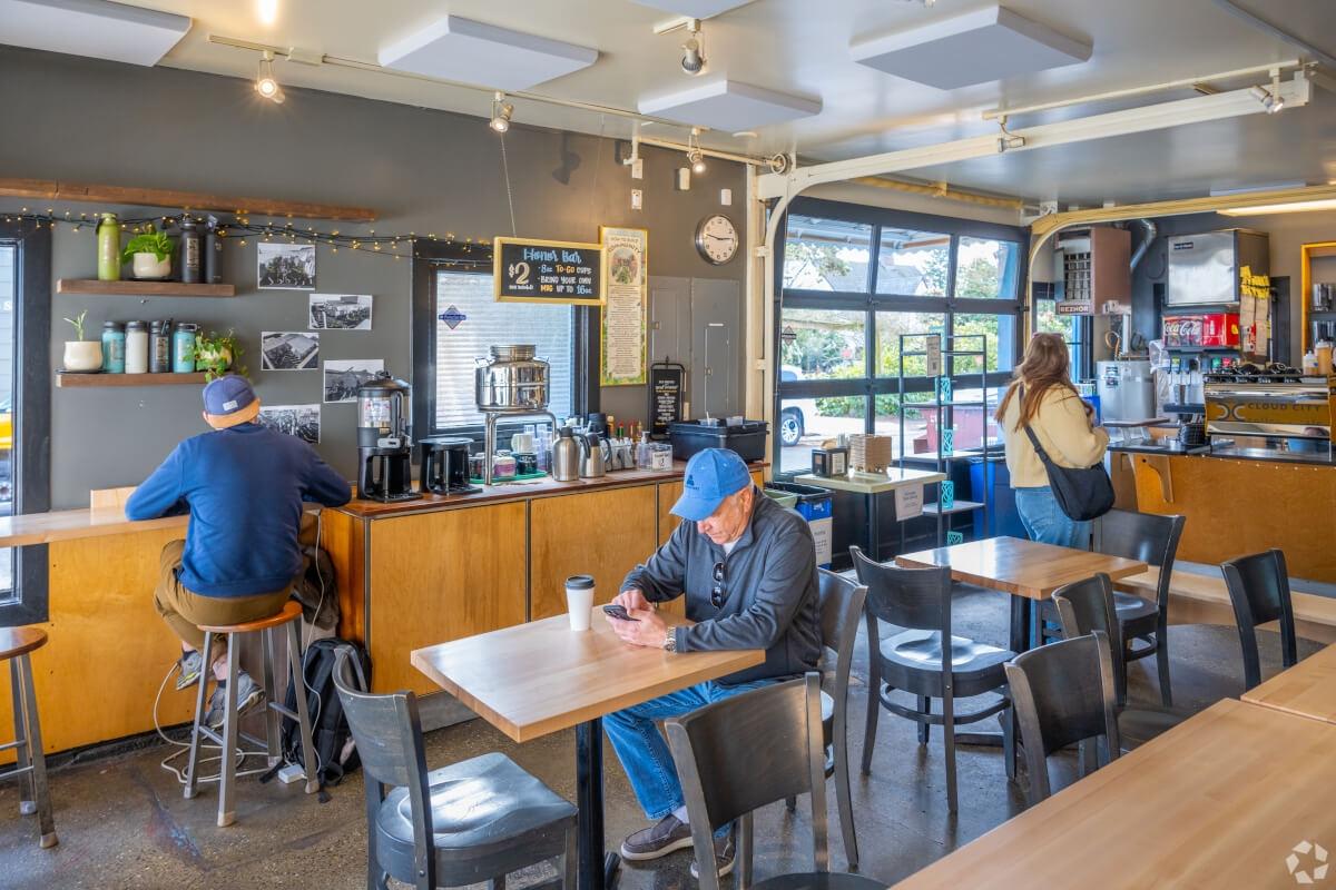 Guests sit at tables at Cloud City Coffee in Maple Leaf.