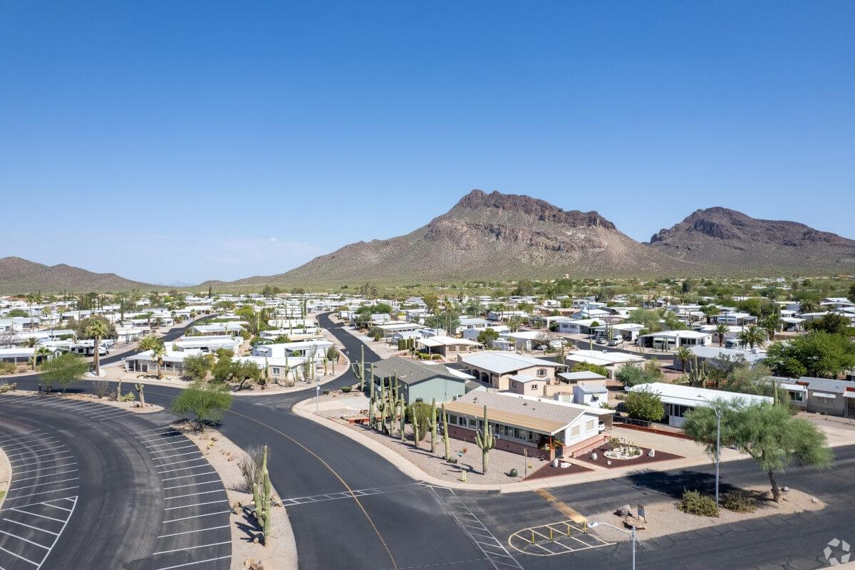 An aerial view of a neighborhood in Tucson with mountains in the background.