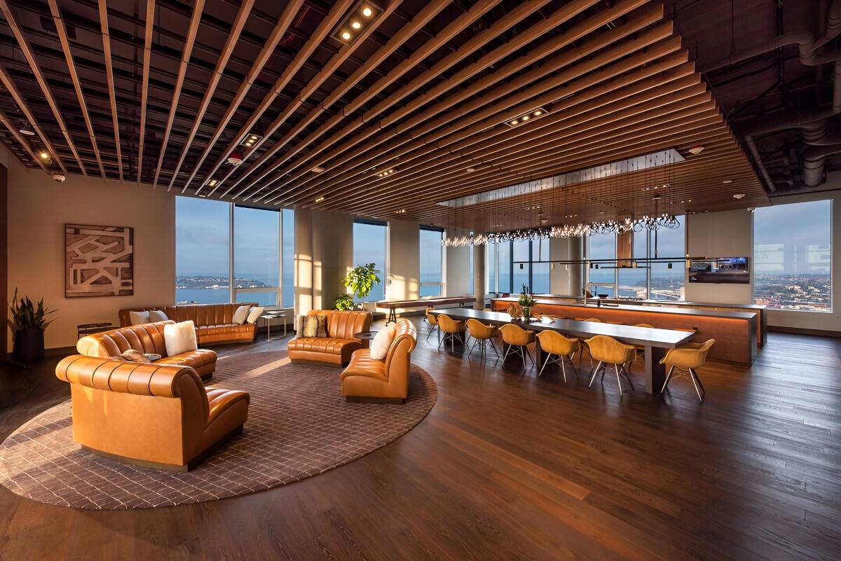 The rooftop lounge consists of a seating, dining, and kitchen area.