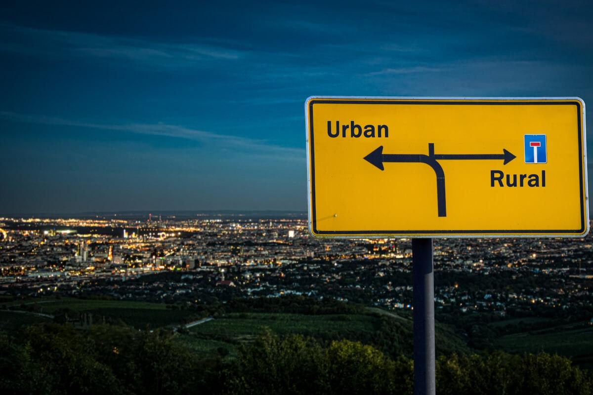 Sign with labeled urban and rural with the arrow pointing two different directions