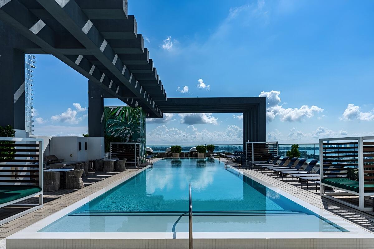 An interesting pergola-like decoration goes over the rooftop pool and deck.