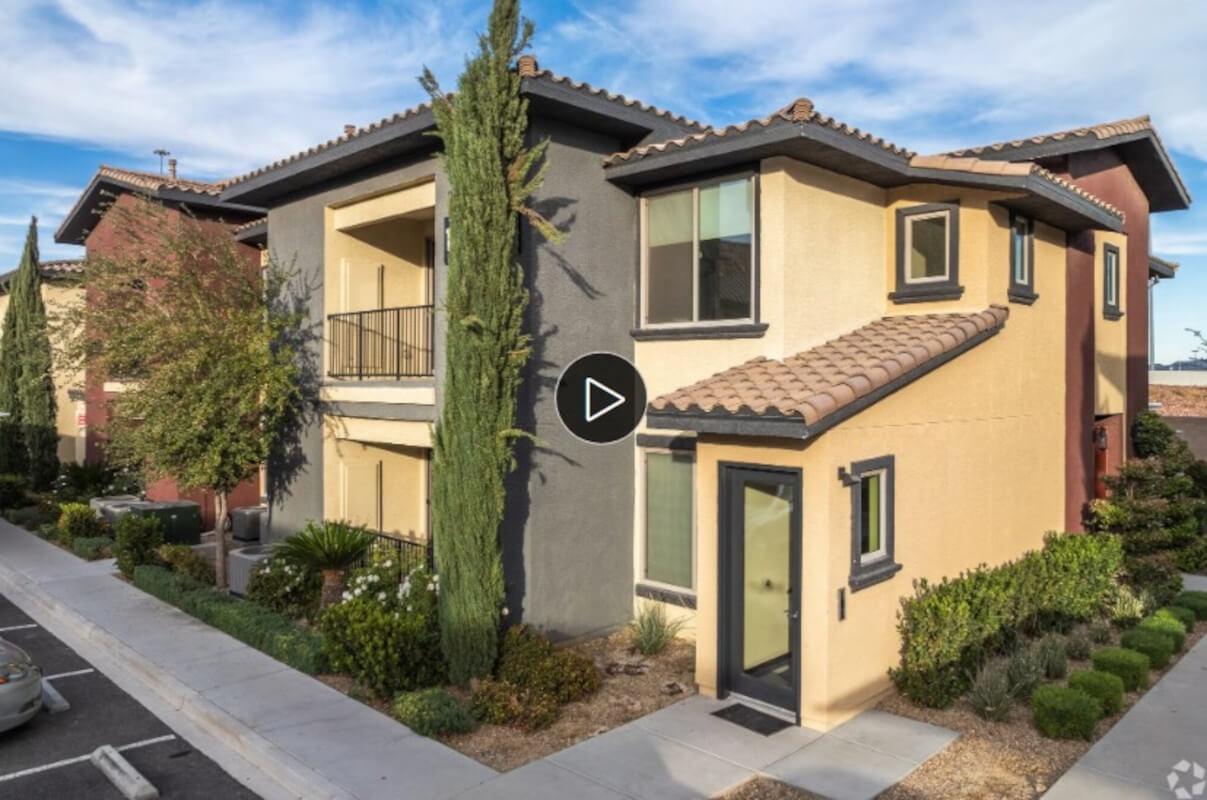 Sunny view of apartment building with video attached