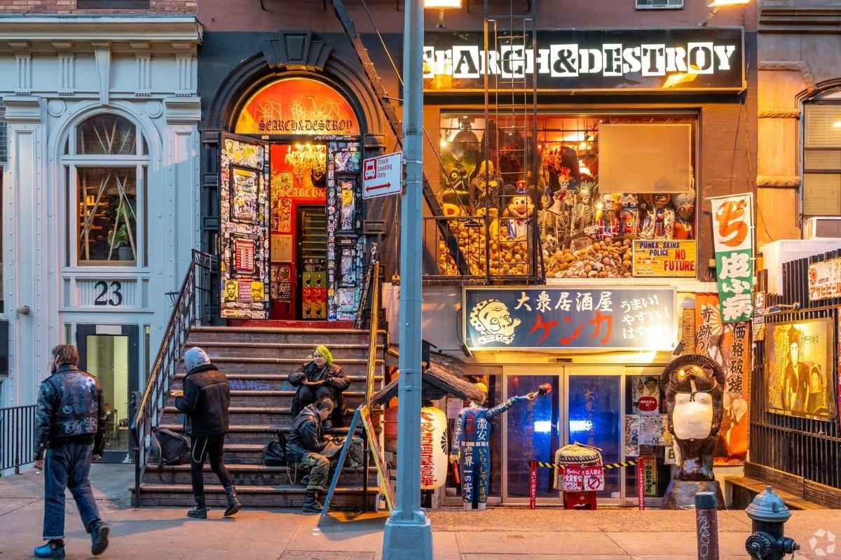 Iconic punk fashion store in East Village featuring vibrant street art, alternative apparel displays, and urban culture appeal near apartment rentals.