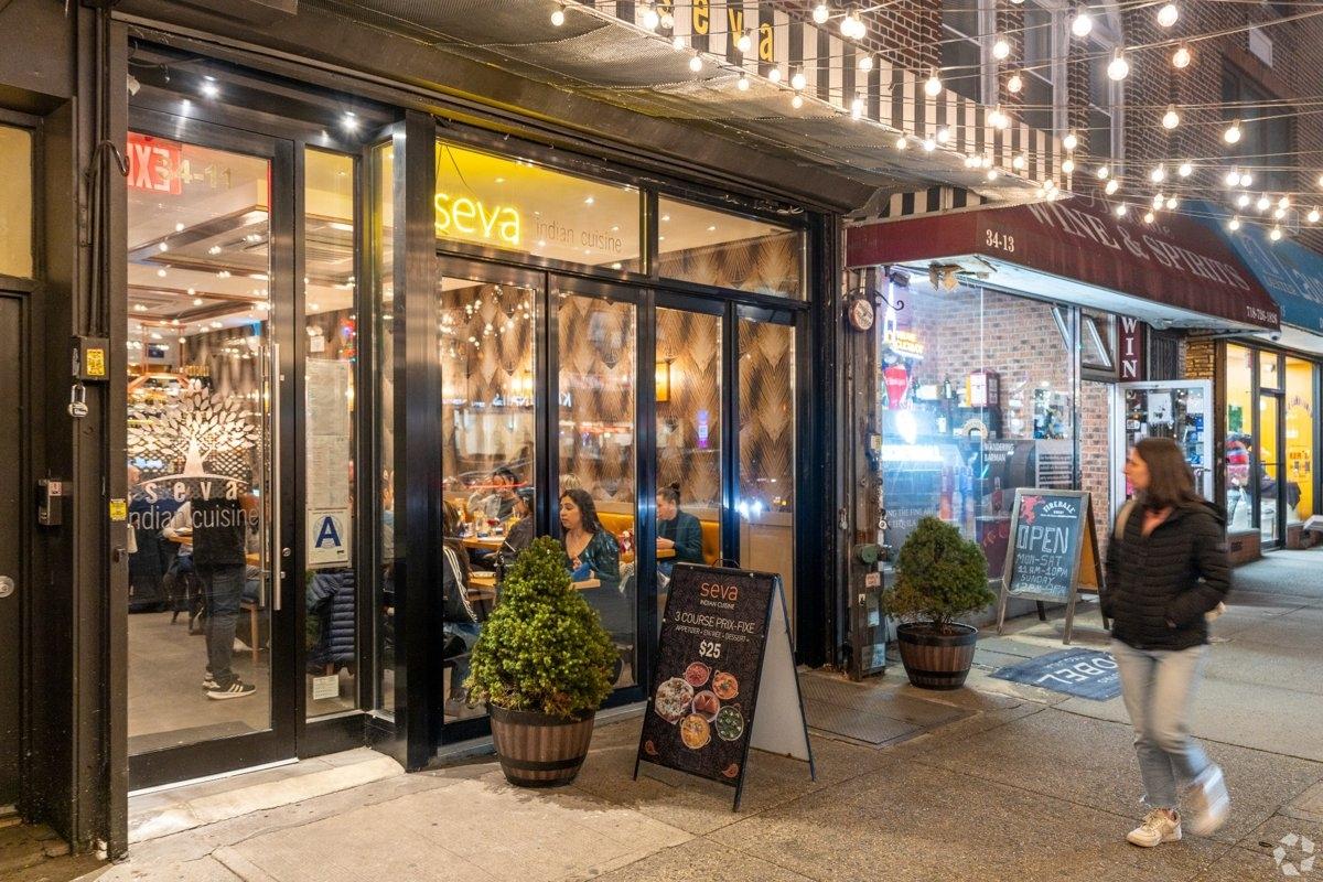 Seva Indian Cuisine in Astoria, featuring warm lighting, inviting decor, and a neighborhood dining scene perfect for apartment residents
