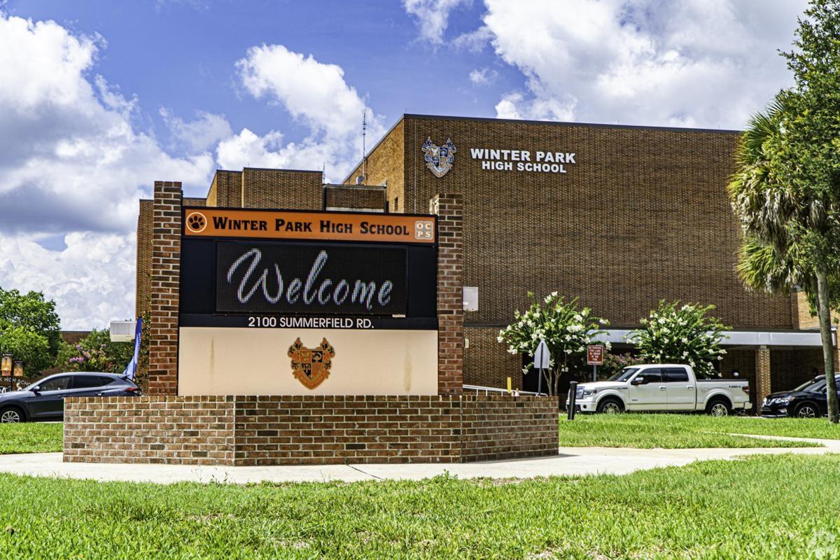 Exterior of Winter Park High School with welcome sign and brick facade, highlighting quality education options near apartment rentals in Winter Park, Florida.