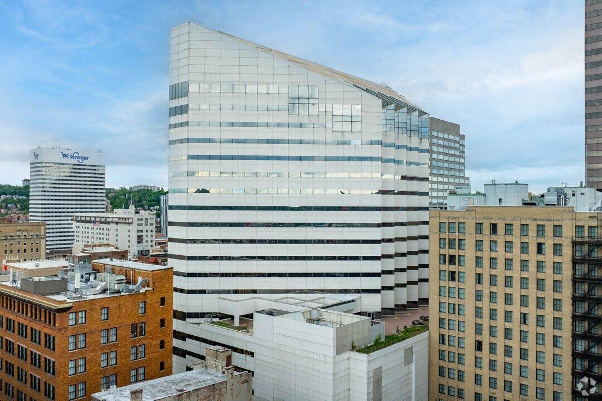 Skyline view of urban office buildings, including Kroger headquarters, showcasing potential for residential conversion projects in downtown areas.
