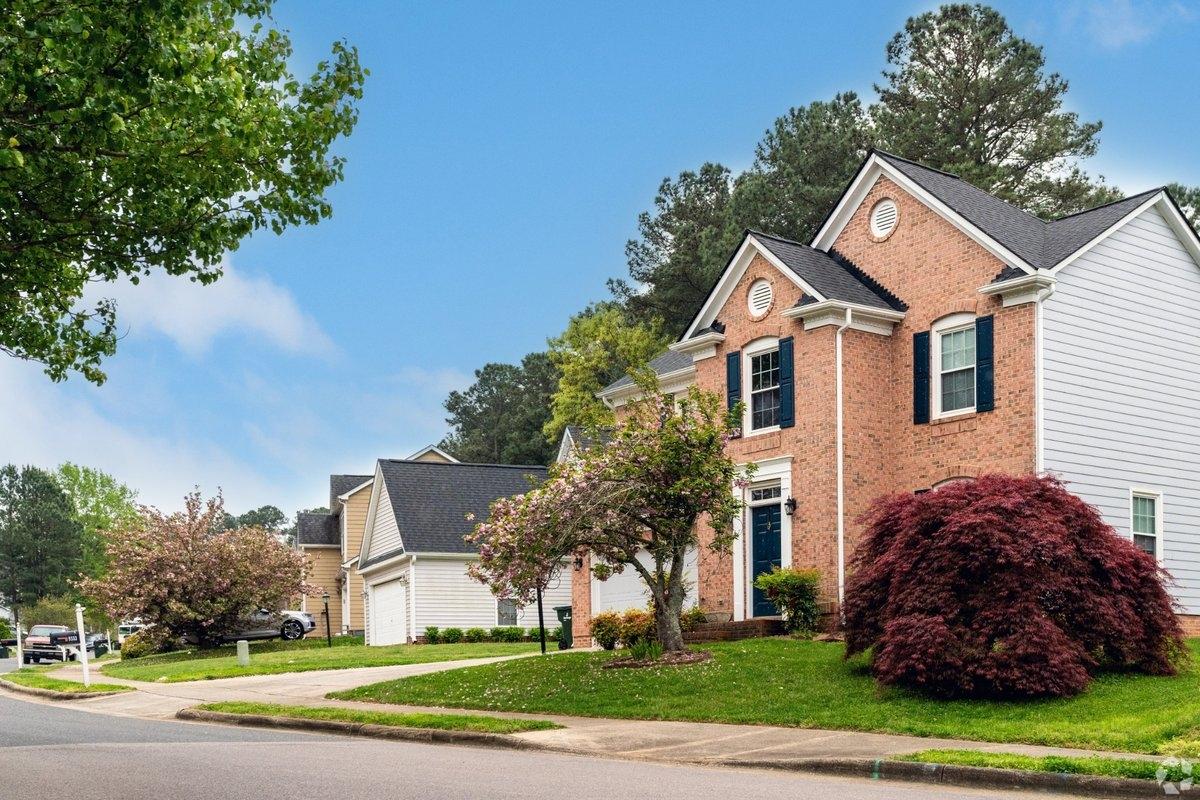 Large brick homes on a street in the neighborhood