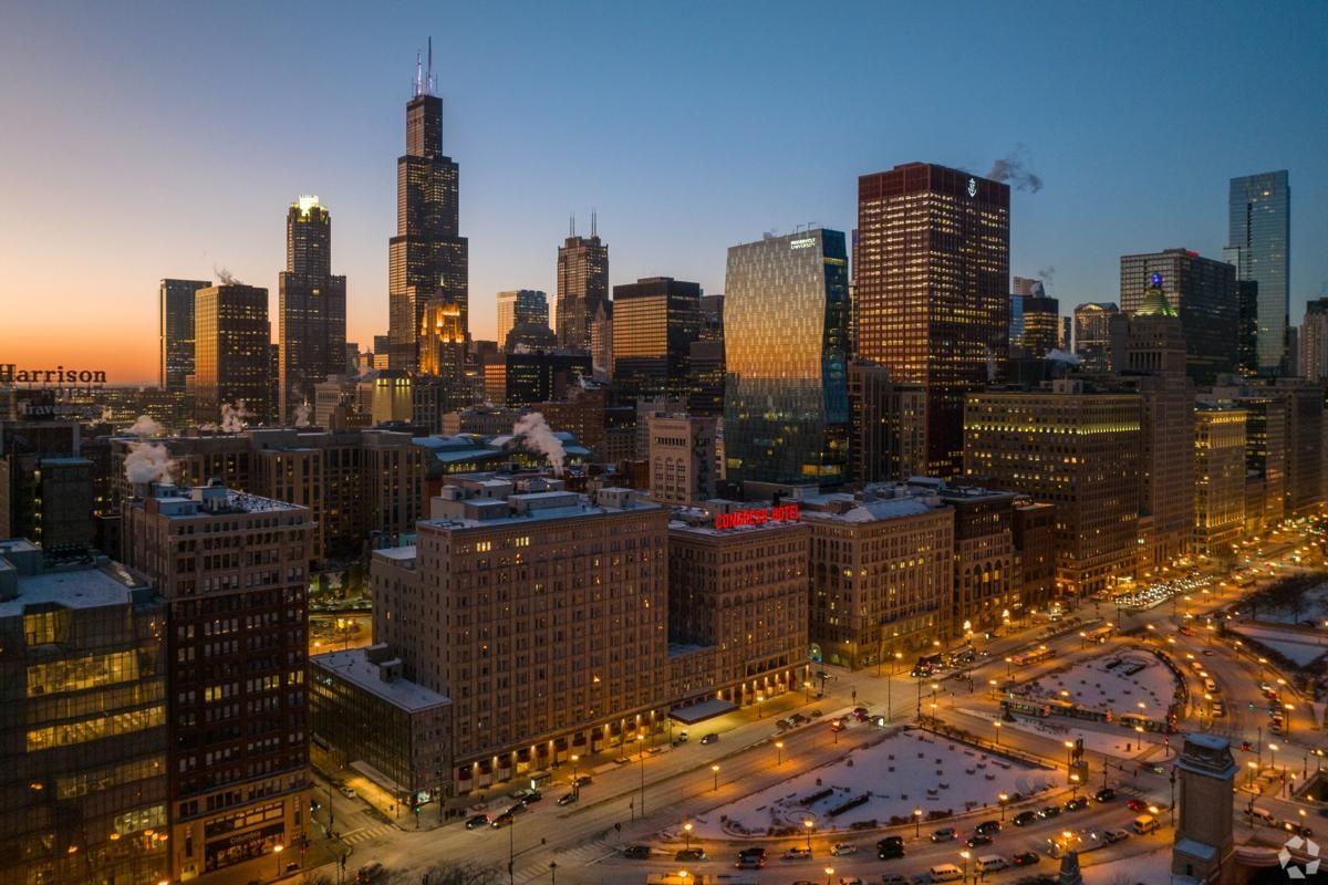Winter dusk view of Chicago Loop featuring Willis Tower and historic Congress Hotel near Millenium Park..