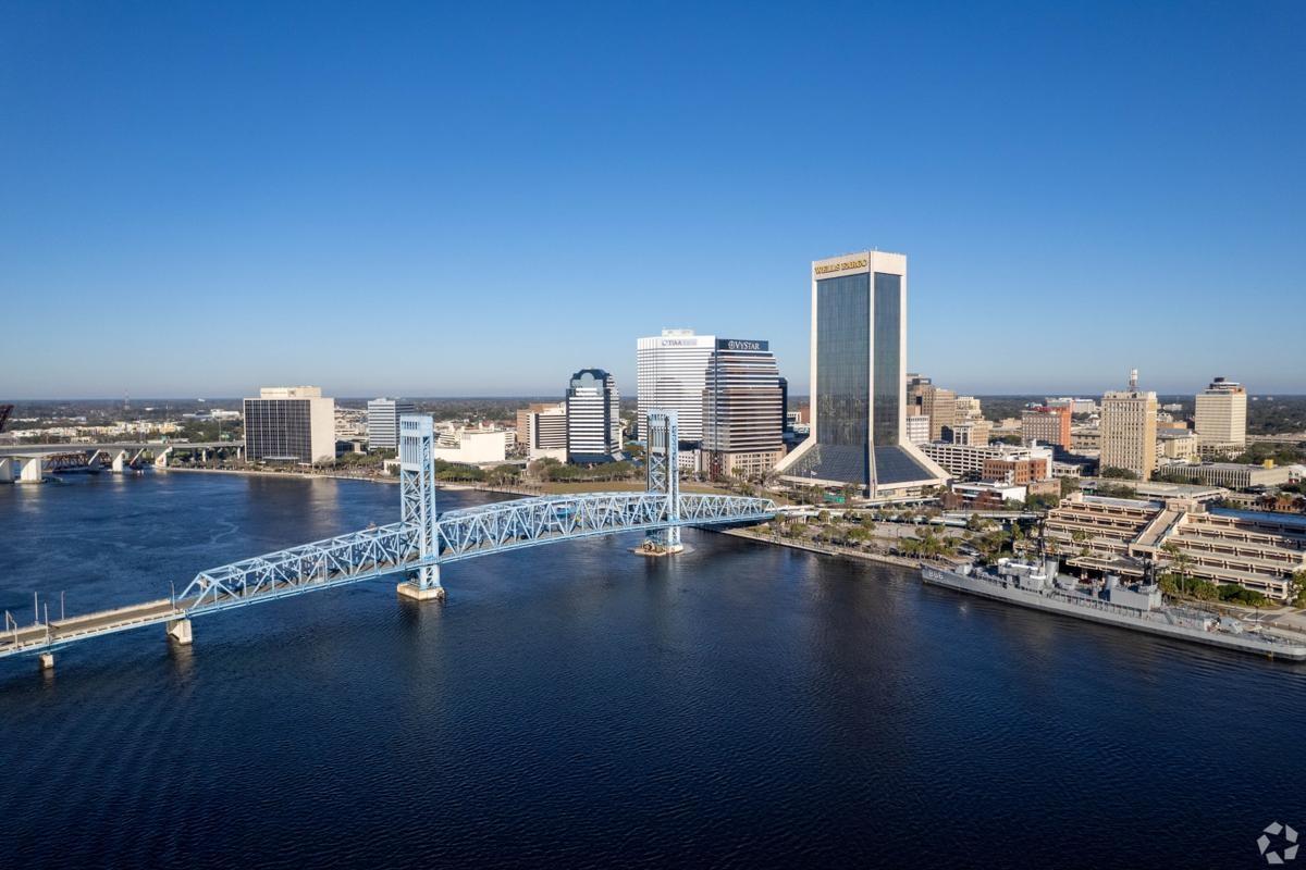 Downtown Jacksonville, Florida featuring the iconic Main Street Bridge, waterfront views along the St. Johns River.