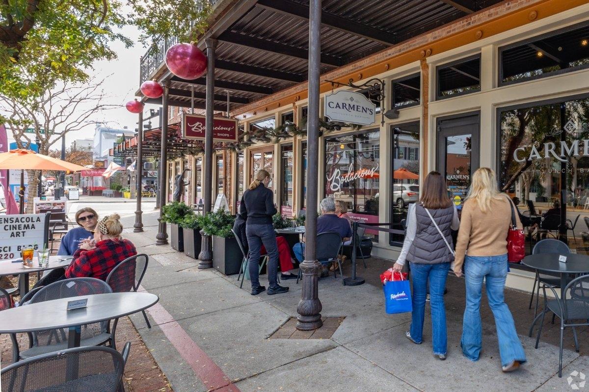 Downtown Pensacola FL with cafes and holiday decor — a welcoming urban scene for apartment hunters near the Gulf Coast.
