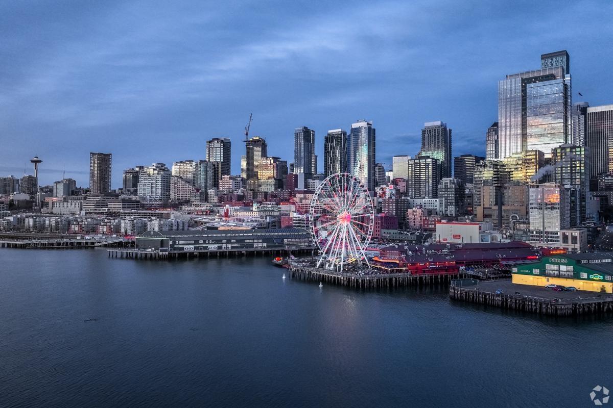 Waterfront skyline of Seattle, Washington with the iconic Ferris wheel overlooking Puget Sound.