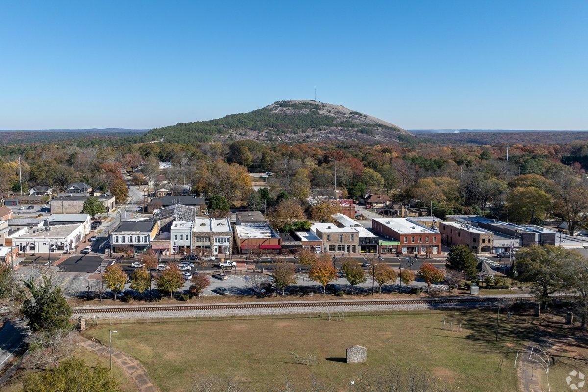 Aerial view of Stone Mountain GA with historic downtown and scenic backdrop — great for renters seeking suburban living with natural beauty.