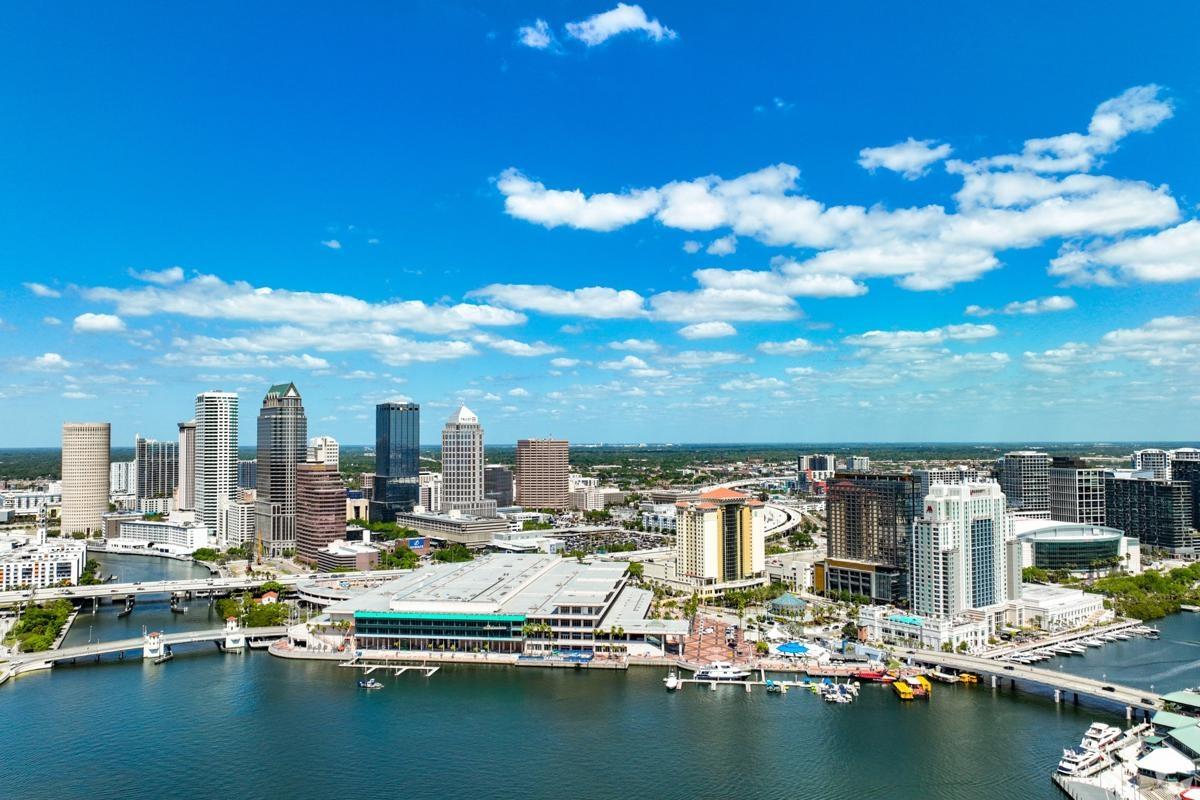 Vibrant skyline of Tampa, Florida showcasing waterfront apartments, luxury high-rises, and bustling downtown attractions near the Hillsborough River.
