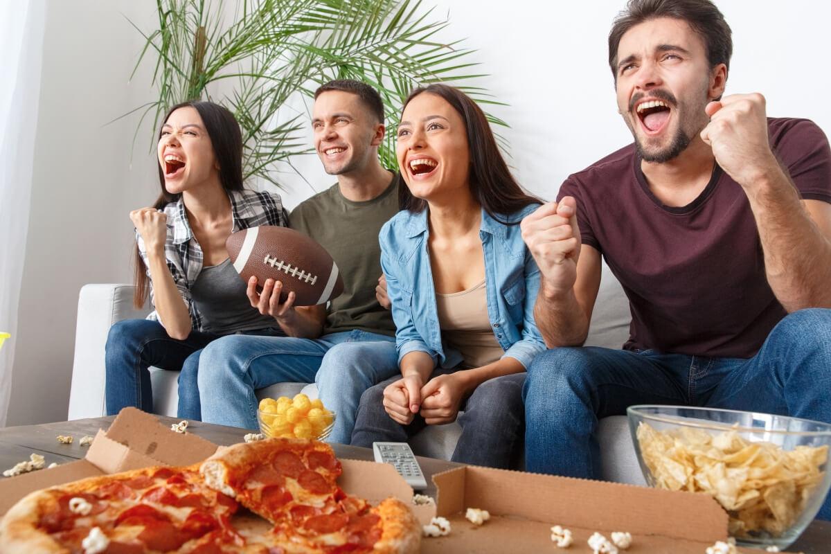 Apartment goers cheer for sports team.