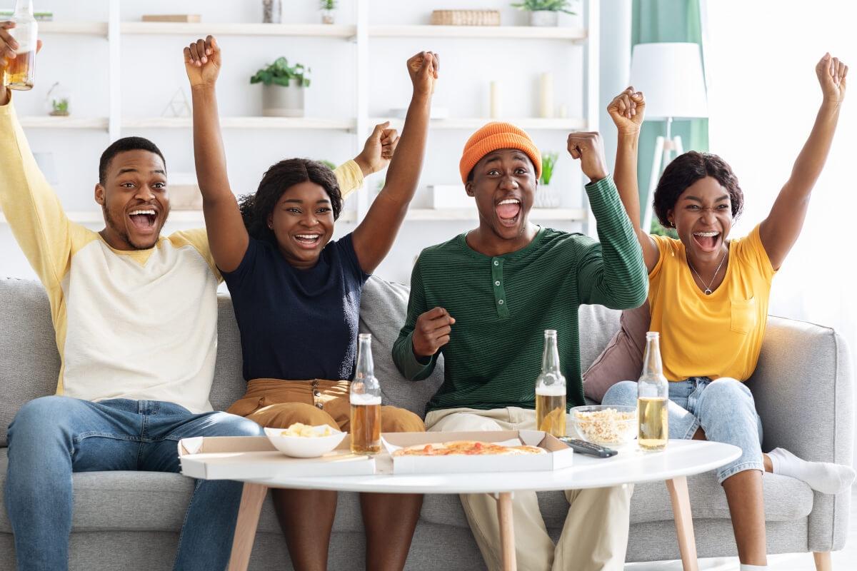 Apartment goers cheer for sports team. 