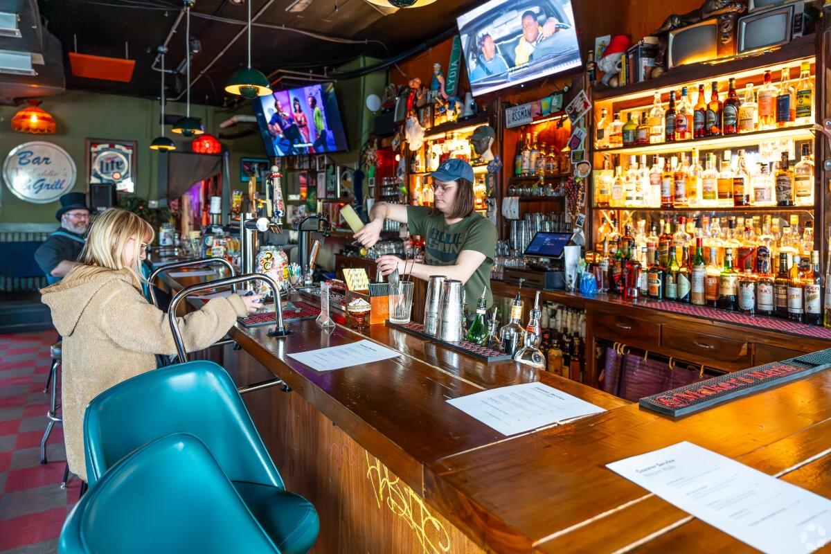 Louisville residents enjoy drinks at a local bar.