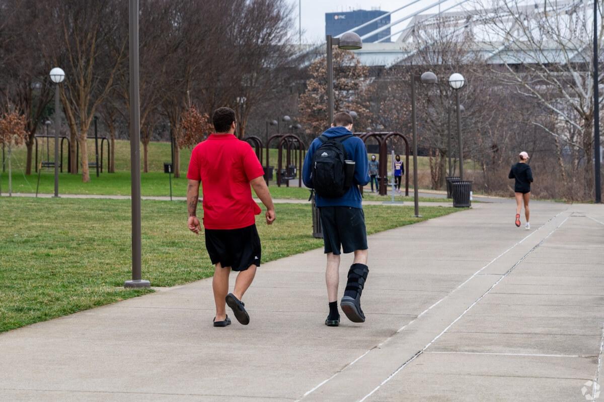 Students walking through the University of Louisville campus