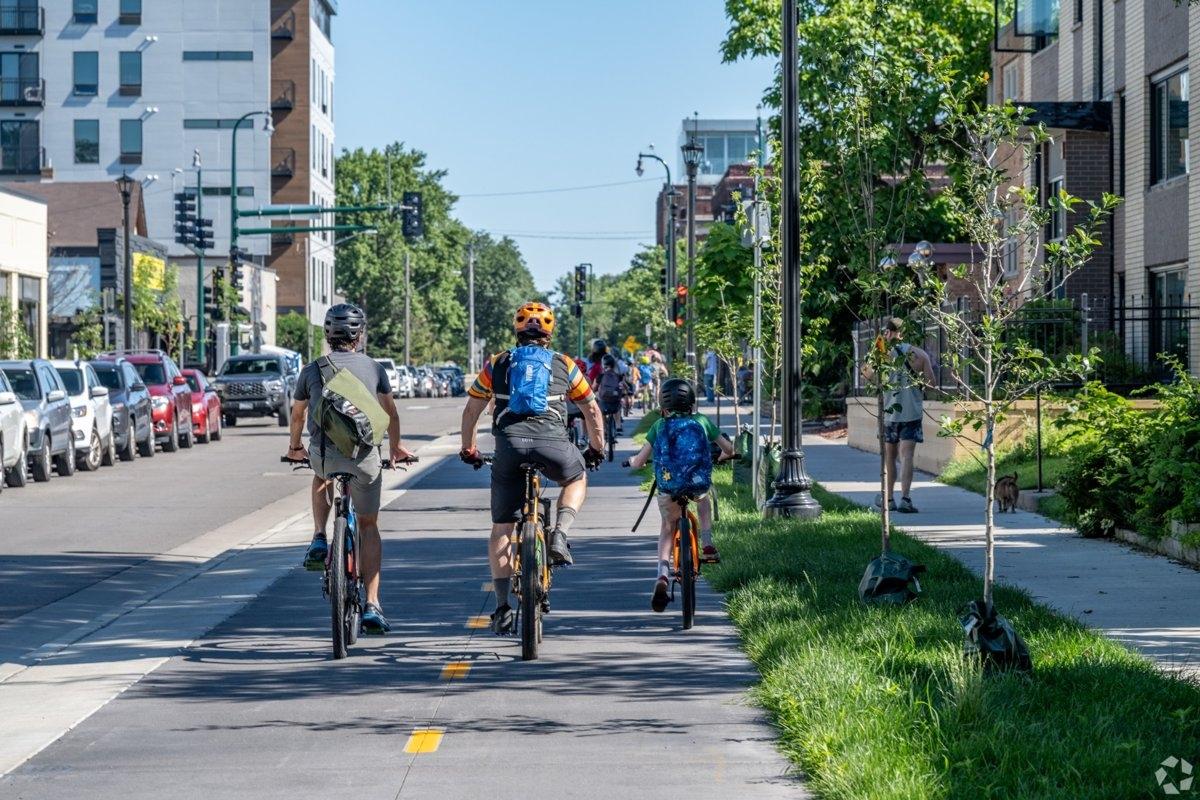 A family riding bicycles on a sunny day in Minneapolis