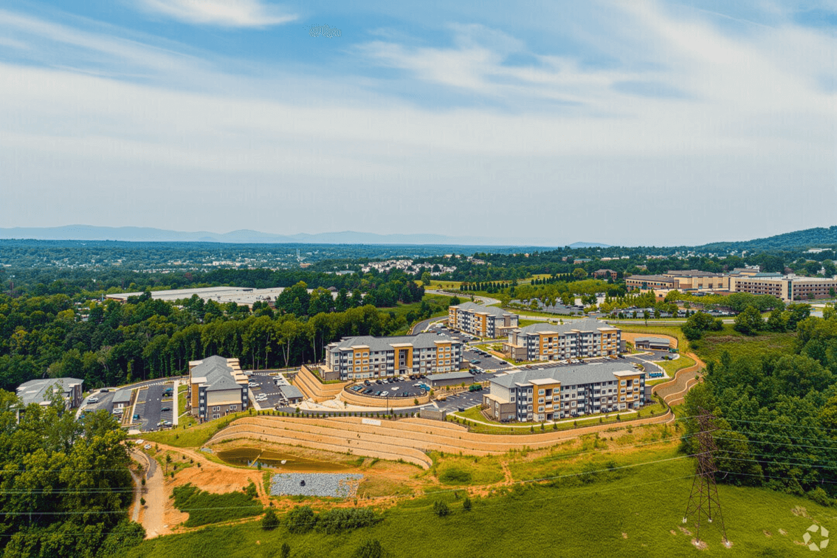 Altoview Apartment Homes sits surrounded by trees.