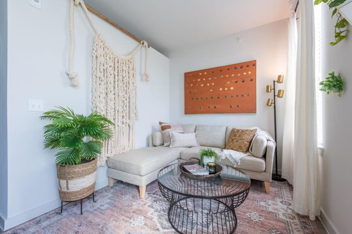 A living area at Bridge at Turtle Creek is decorated with boho-style decor.