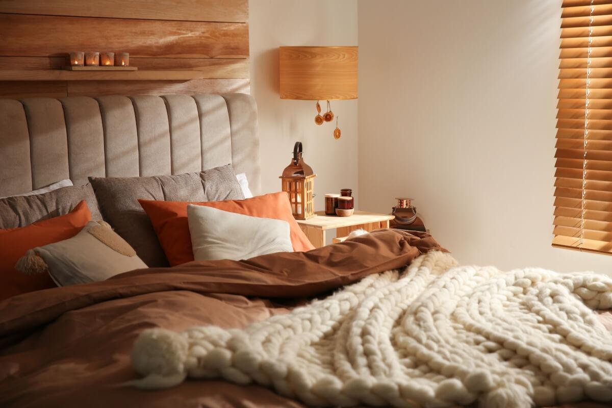 Bedroom with chunky knit throws perfect for fall