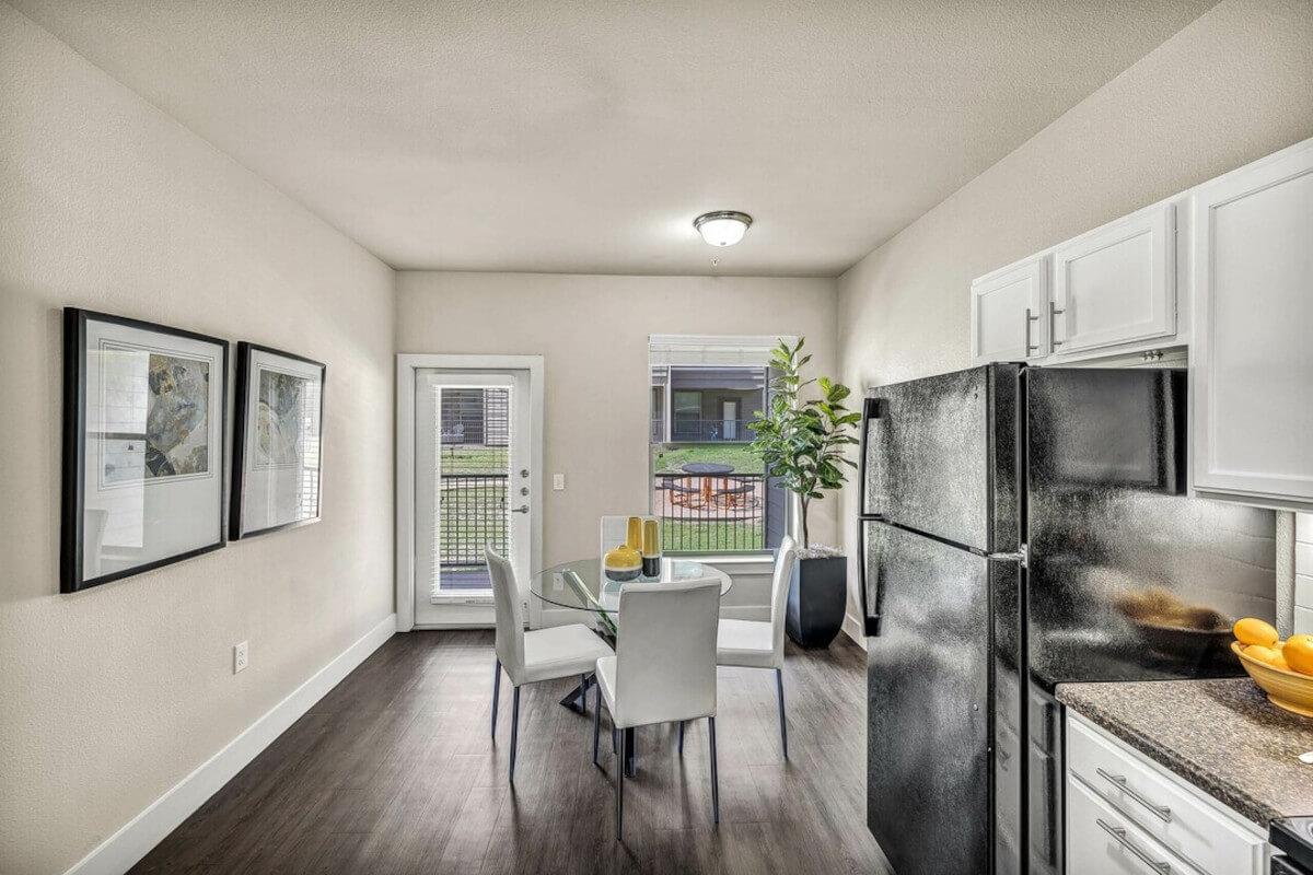 Natural sunlight in the kitchen and dining area of a unit at the Lotus Village apartment community.