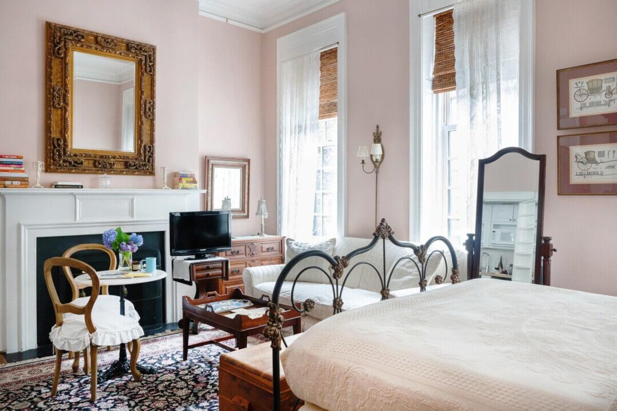 A pink bedroom at 1871 House.