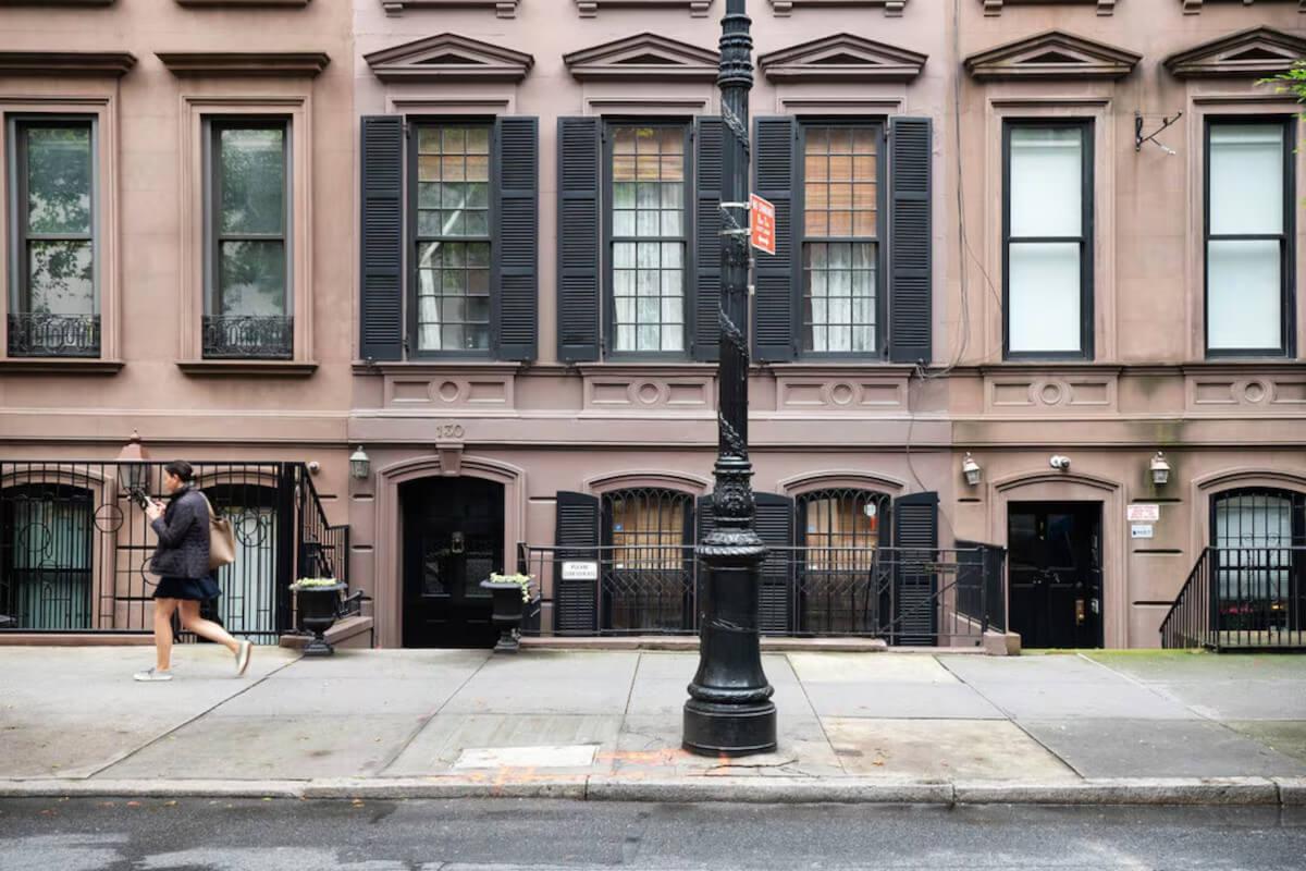 A person walks past 1871 House in Manhattan.