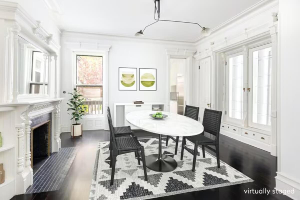 The dining room at 505 1st Street in Brooklyn has the original Victorian mantels.