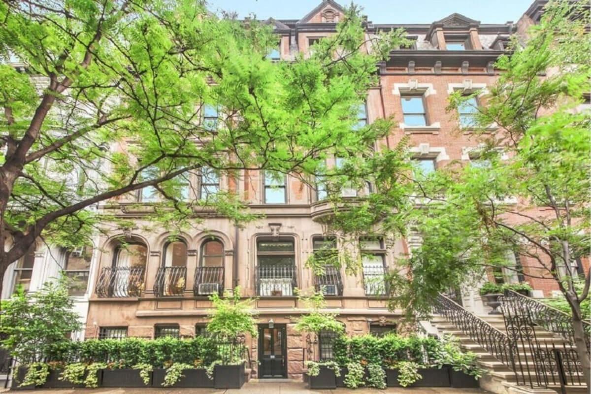 Trees in front of 54 East 53rd Street, a stunning brownstone in Manhattan.