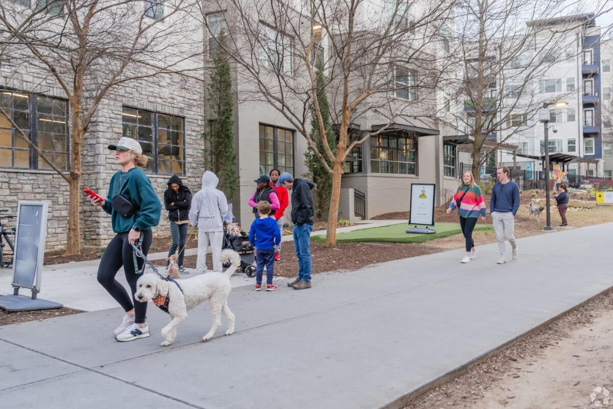 Pedestrians walk through Inman Park in Atlanta.