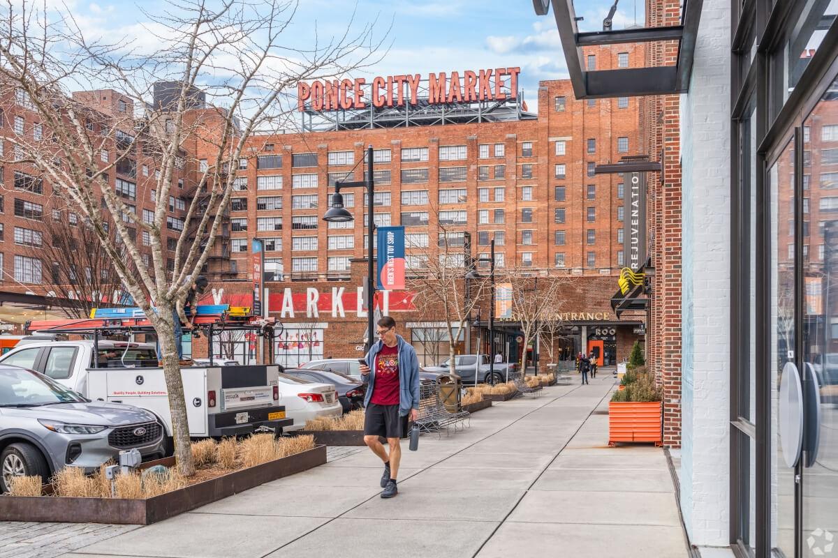 Man strolls through Ponce City Market. 