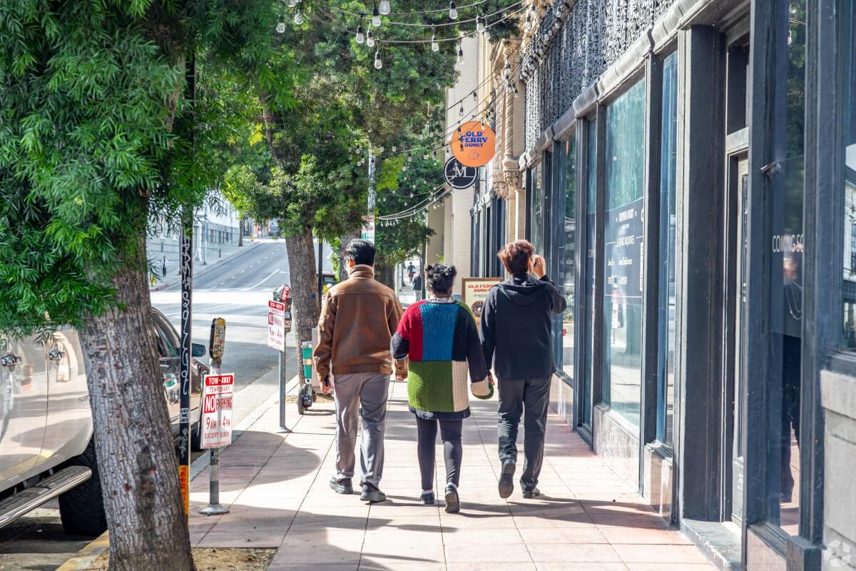 People walk down the street in Koreatown.