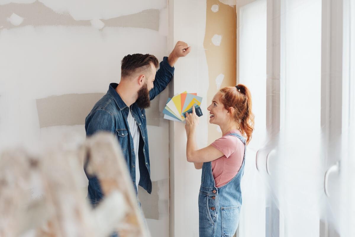 Tenants examine paint swatches for apartment renovation.