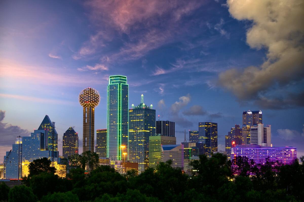 The lit-up skyline of Dallas, TX.