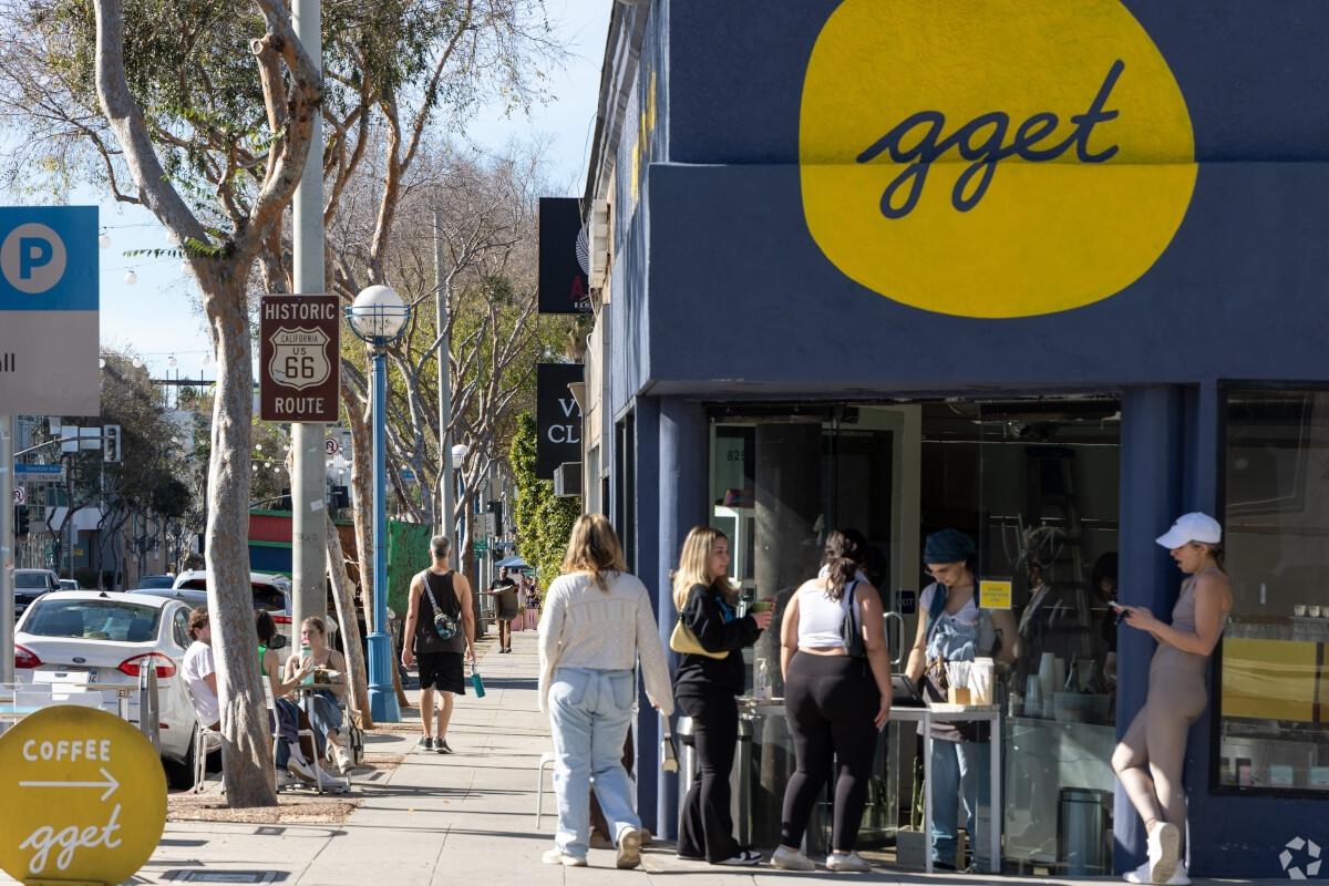 People gather for coffee and walk the streets of West Hollywood.