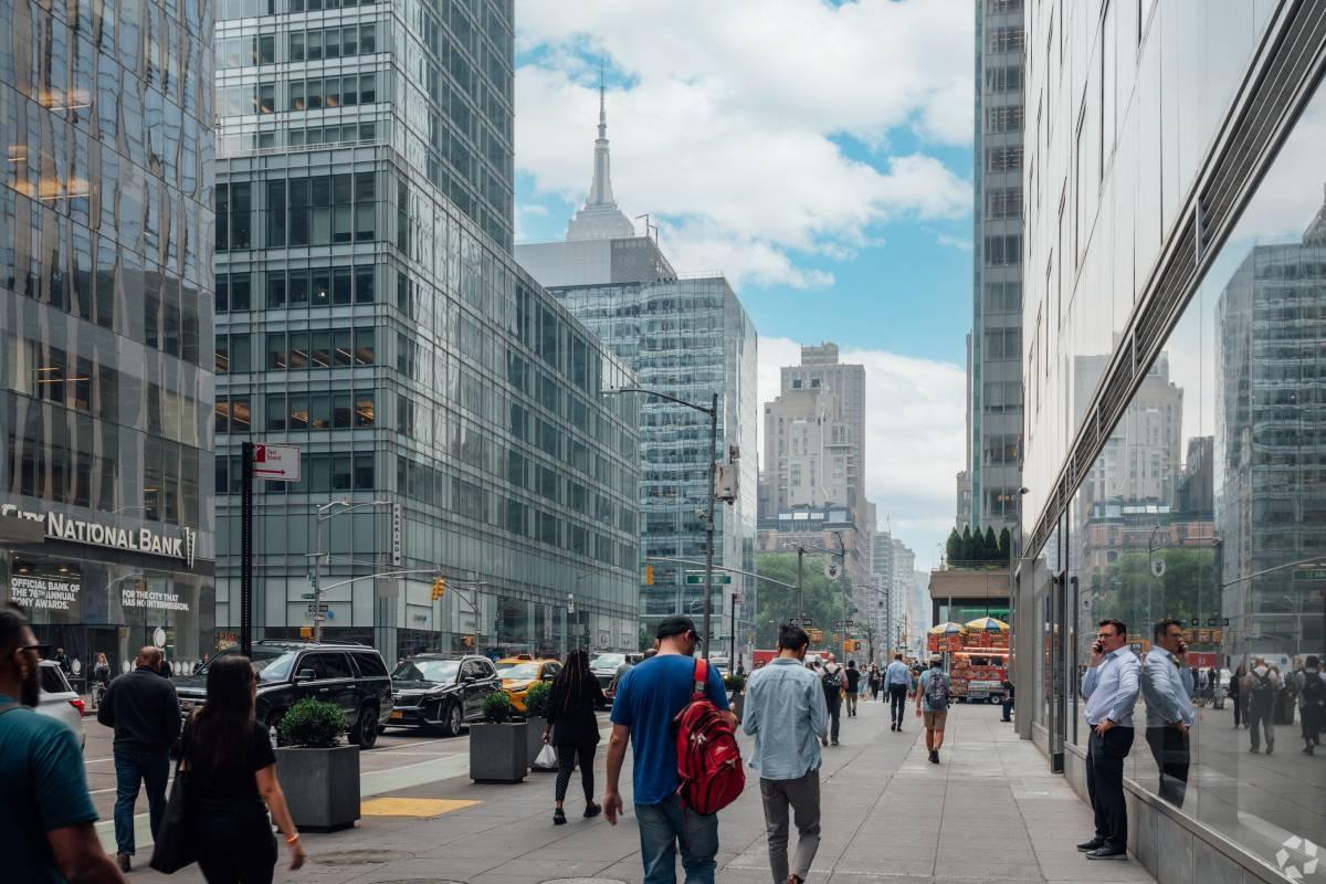 Pedestrians walk throughout Midtown Manhattan.